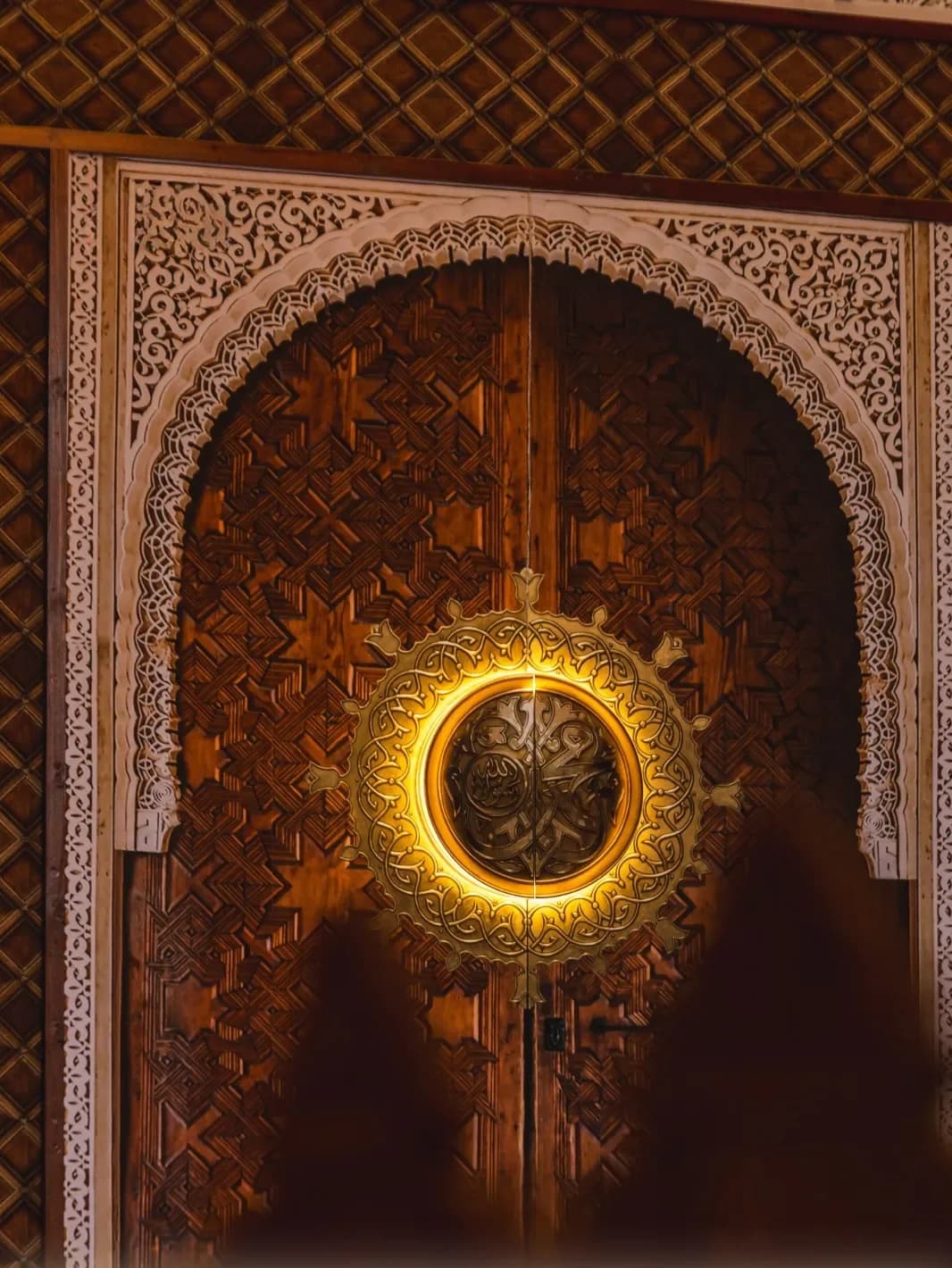 Carved timber doors lit from within