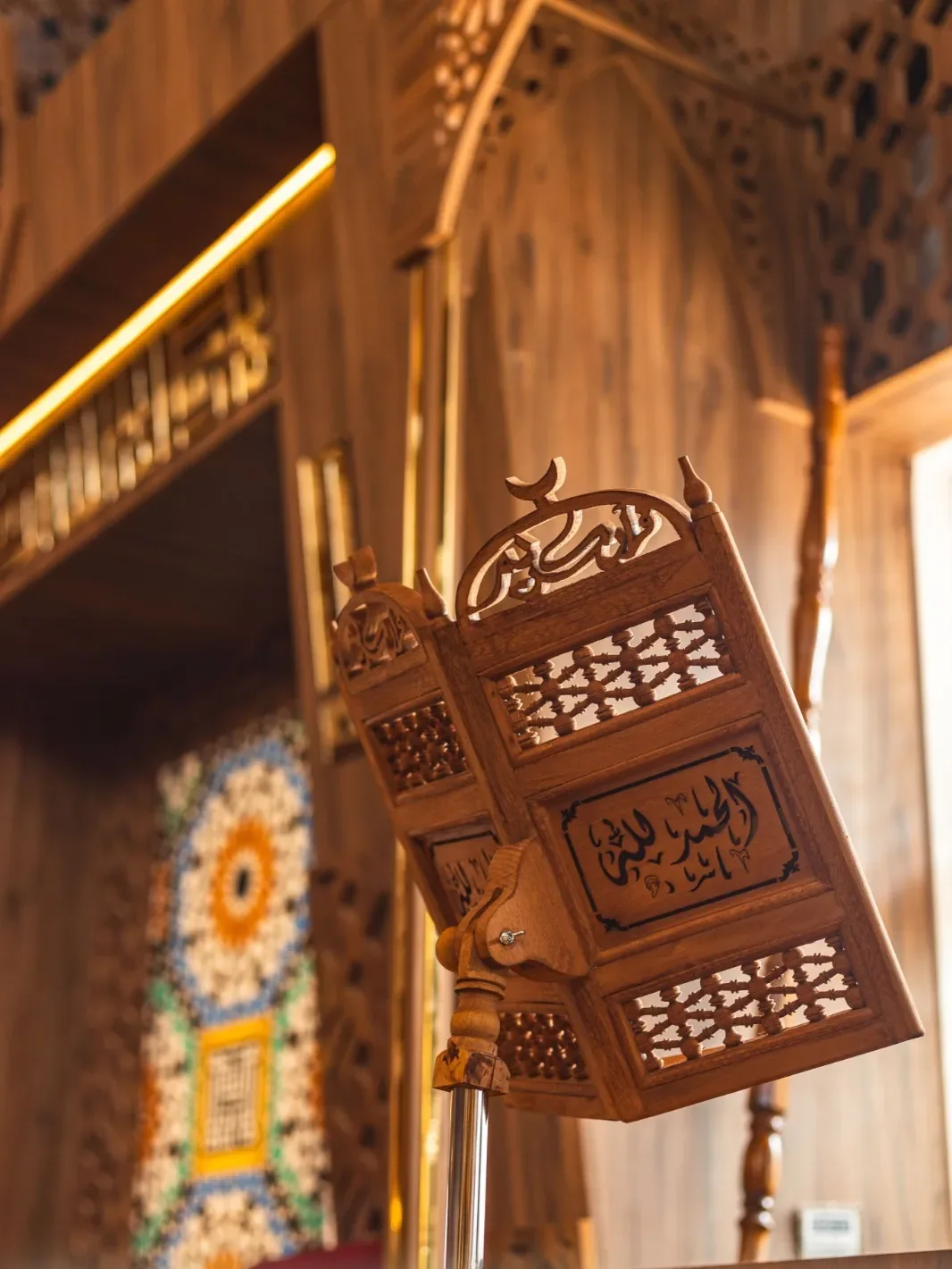 Carved timber rehal with calligraphy