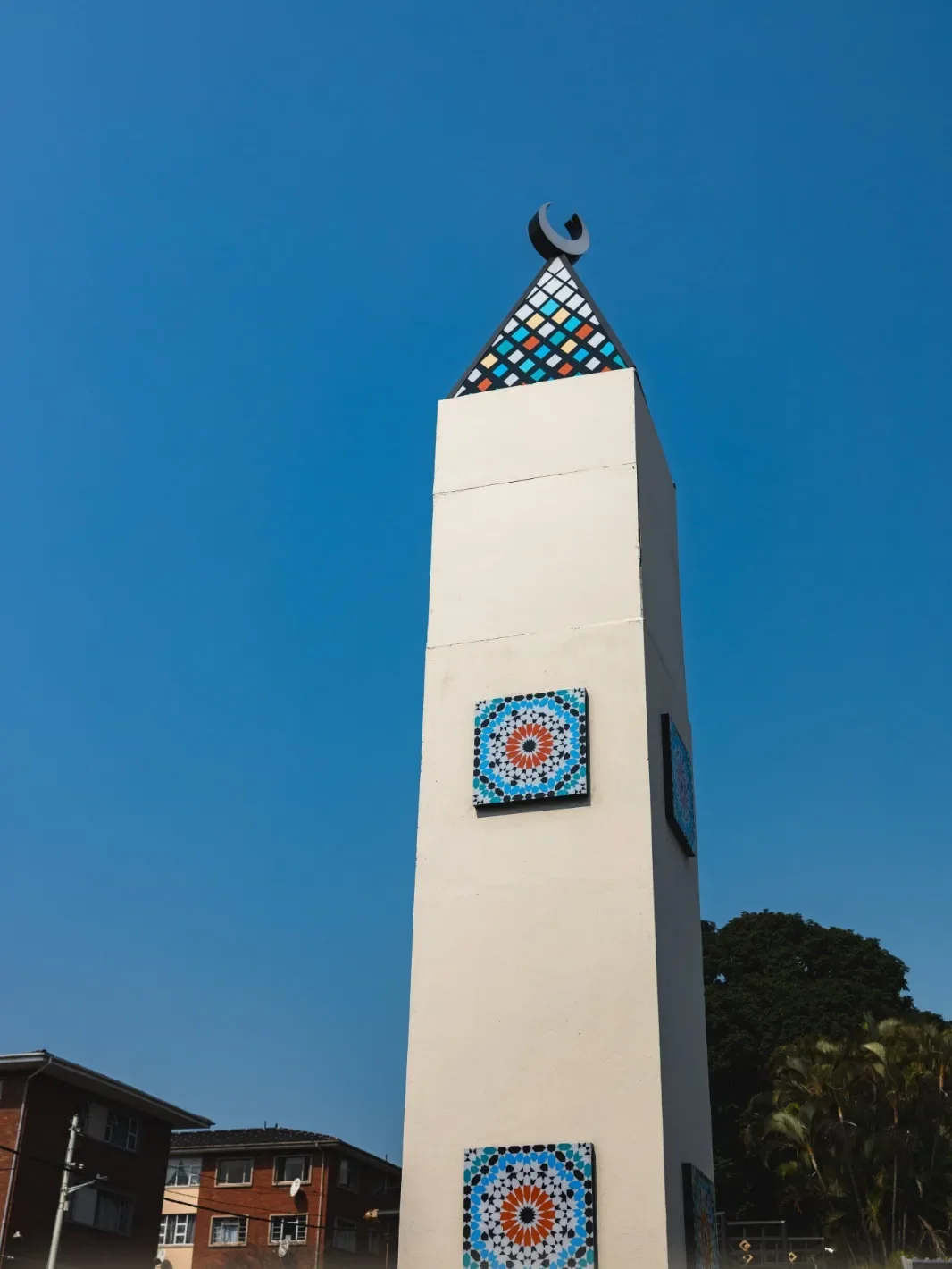The minaret against a blue sky